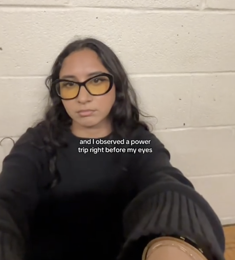 woman sitting in jail cell